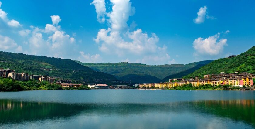 A scenic view of one of the most beautiful lakes in Pune, with golden sunset reflections on the water