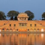 An image of the iconic Jal Mahal in Rajasthan, with calm waters and a scenic view