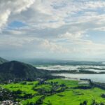 Scenic view of the largest freshwater lake in India with calm waters and lush greenery.