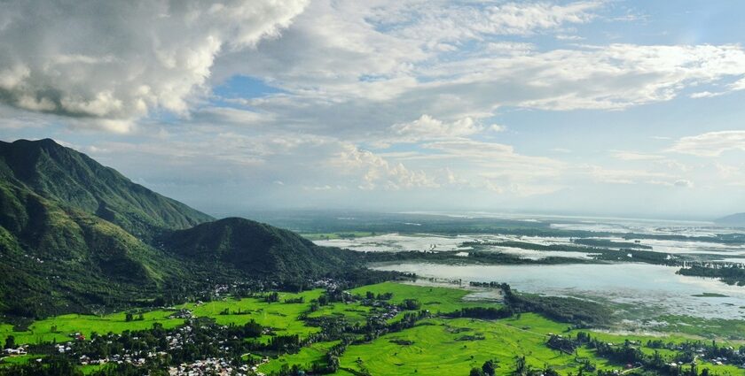 Scenic view of the largest freshwater lake in India with calm waters and lush greenery.