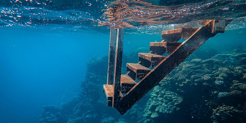 Steps attached to boats that help scuba divers to get underwater without jumping.