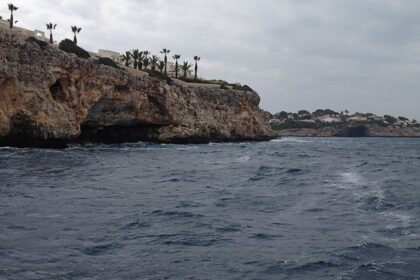 A serene view of the coastline of Mallorca during day time - scuba diving in Mallorca