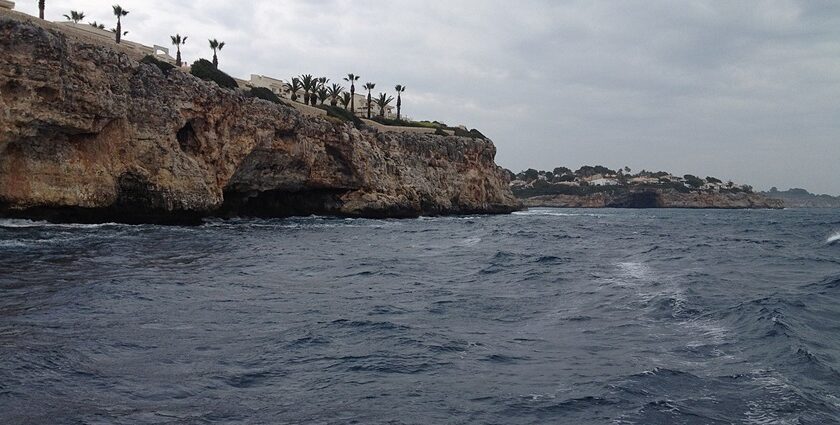 A serene view of the coastline of Mallorca during day time - scuba diving in Mallorca