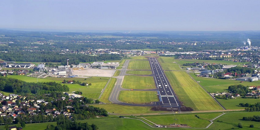 The view of an airport runway, which serves as a facilitating factor for flight takeoffs..