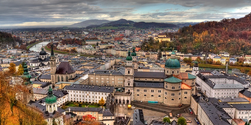 A historical street in Salzburg with medieval-style buildings and charming cobblestone roads