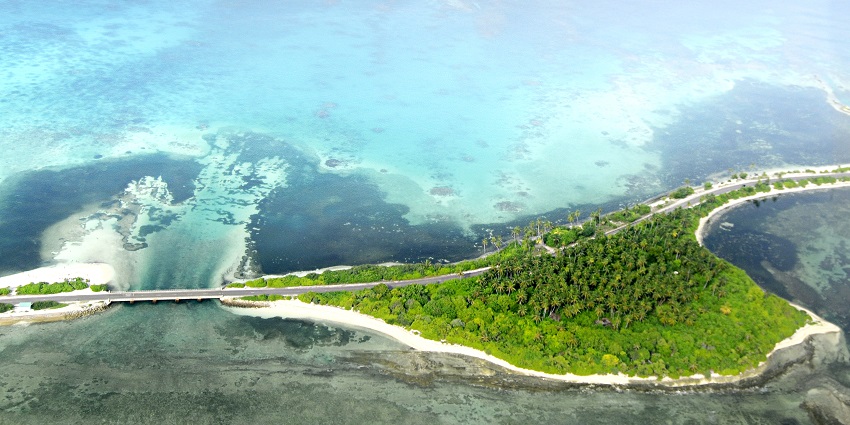 An aerial view of Maldives featuring its coastal heaven decked with turquoise blue waters.