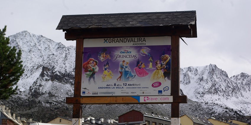 View of a sign board for the skiing enthusiasts in Andorra Pas De La Casa, surrounded by scenic landscapes.
