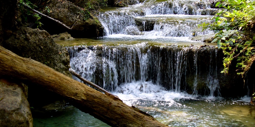 Picturesque view of a waterfall inside the Erawan National Park in Kanchanaburi