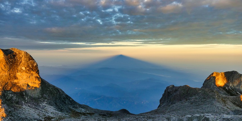 Climbers climbing the Rocky stairs at Mount Kinabalu, a place to visit in Malaysia