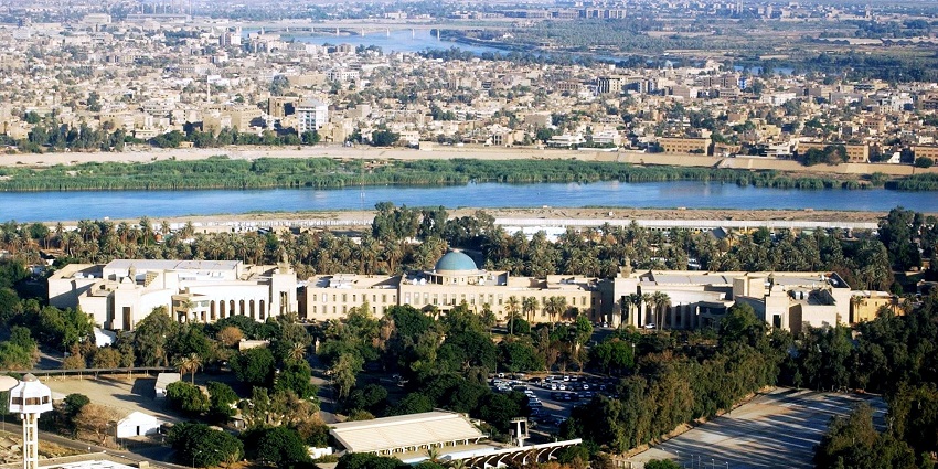 Aerial view of Baghdad, Iraq, showing the Republican Palace complex with a blue dome