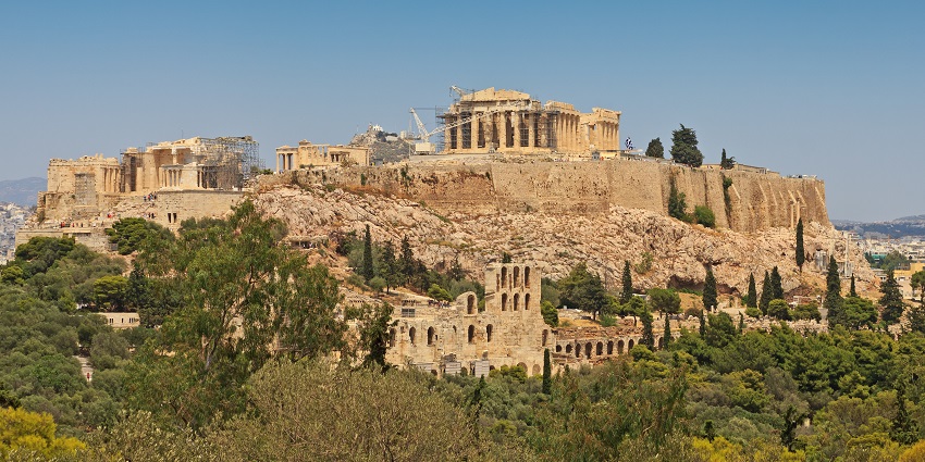 Stunning Philopappos Hill, a panoramic view of the Acropolis under the clear skies.