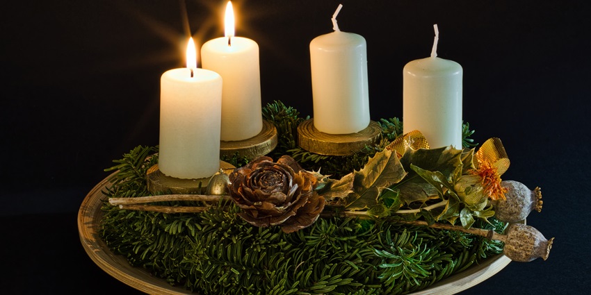 An image showing an Advent wreath with two burning candles, symbolising the Advent season.