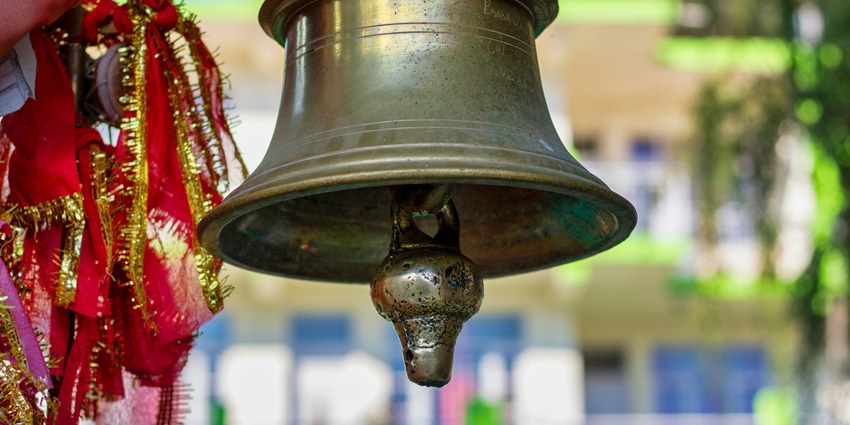 An image of a bell at Agnitheertham which is one of the oldest temples in Rameshwaram.
