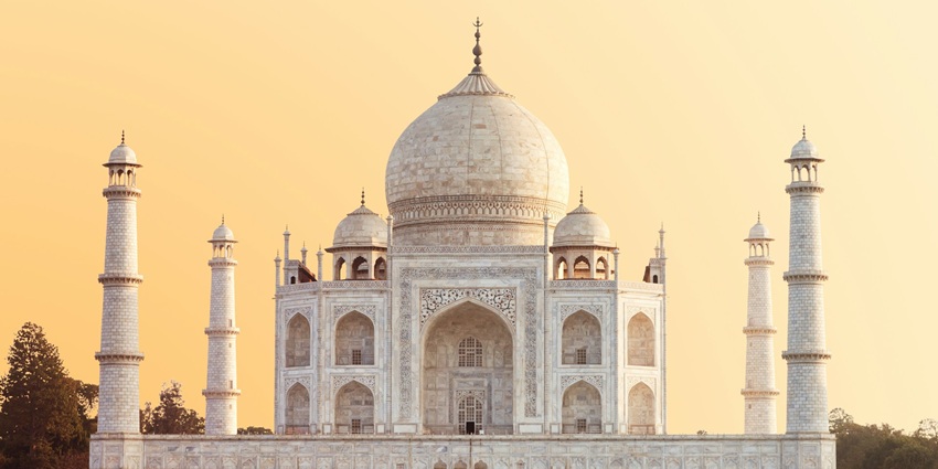 An image showing a view of Taj Mahal, a major attraction in Agra, India for travellers.