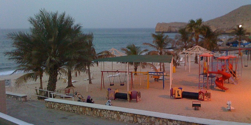 Shores of Al Hamra Beach, one of the finest Ras Al Khaimah beaches, offering golden sands