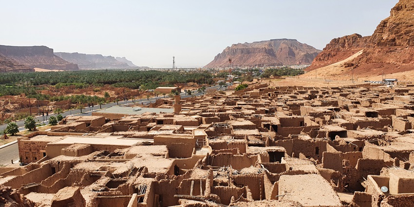 Ancient site with rock formation and Nabatean tombs, featured in Saudi Arabia travel guide