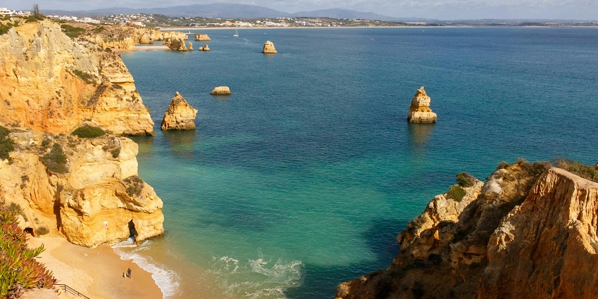 Admire Algarve’s stunning sea caves, golden beaches, and dramatic limestone cliffs.