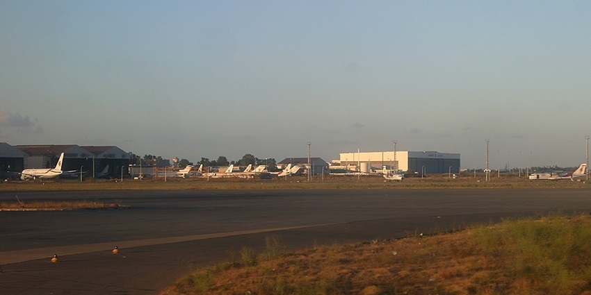 Image of the Algiers Houari Boumediene Airport with airplanes parked at a distance
