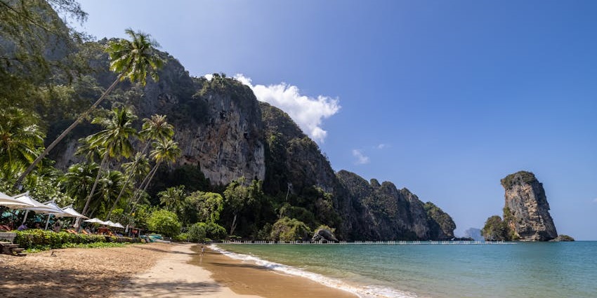 Enjoy a tropical getaway at Ao Nang Beach, a coastal escape near the Tiger cave temple.