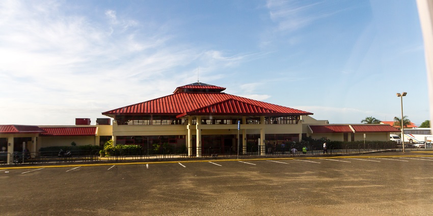 Red roofs of the Arroyo Barril Airport Terminal, one of the airports in Dominican Republic.