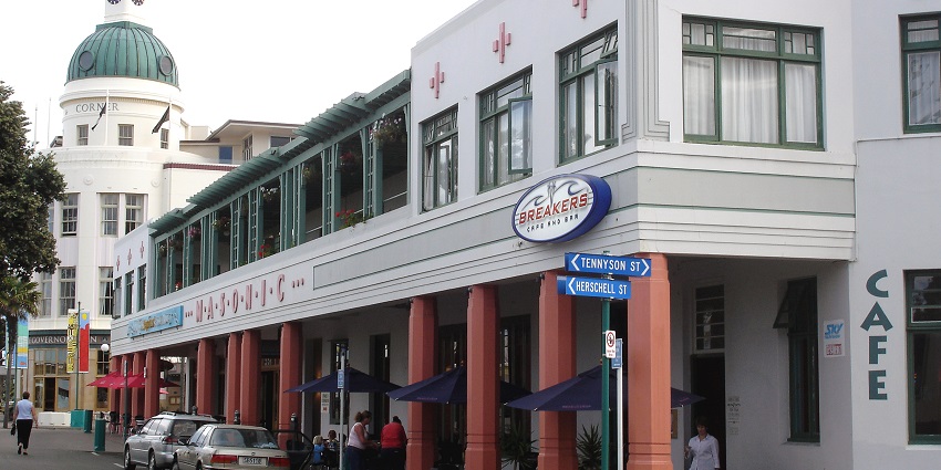 A glimpse of the bustling Art Deco Napier District decked with people and local shops.