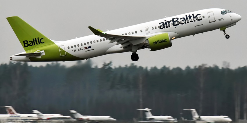A colourful Air Baltic flight getting airborne at an airport
