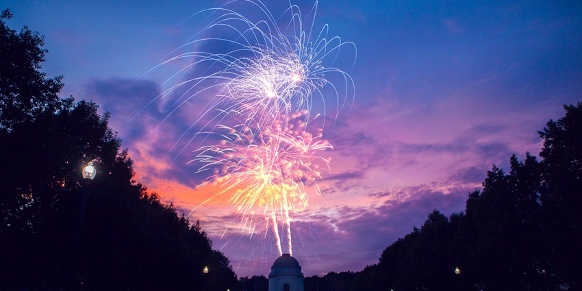 Sky with vibrant, colorful fireworks and silhouettes to see, one of the things to do in Forest lake.