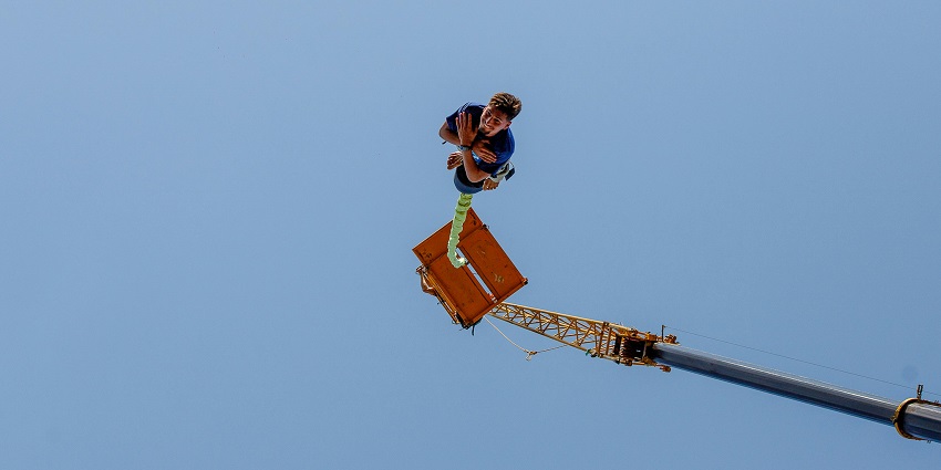An image of a man reverse bungee jumping in one of the world's best reverse bungee jumping spots.