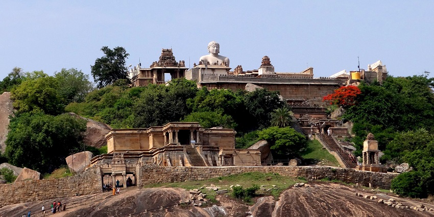 Gomateshwara Temple atop a rocky hill in Shravanabelagola, with surrounding structures
