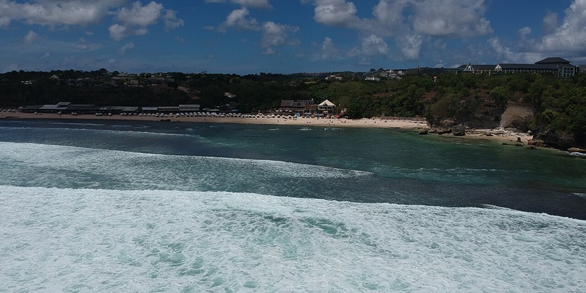 Balangan Beach, a Kuta gem, offers stunning views, surfing waves, and a relaxed vibe.