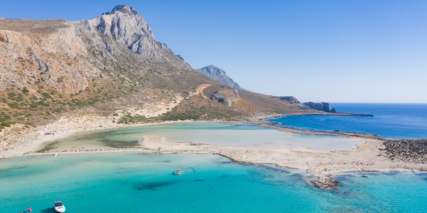 A breathtaking lagoon with pink sand, exotic blue waters, and stunning landscapes
