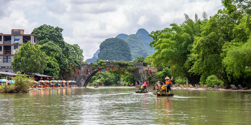 An image of people bamboo rafting on the Rio Grande, one of the best things to do in Port Antonio, Jamaica.