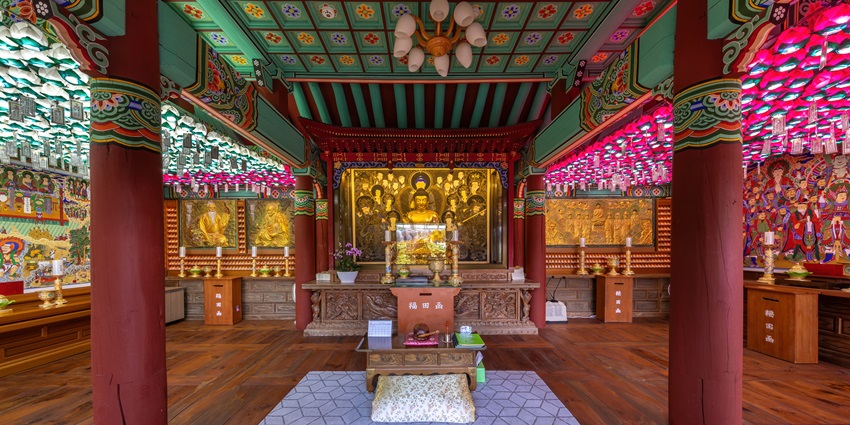 Interior view of a serene Buddhist temple near Seokguram Grotto in Gyeongju, South Korea.
