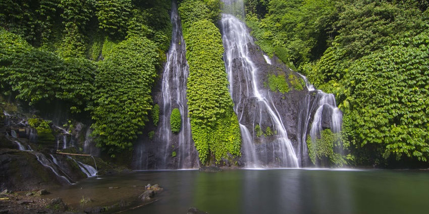 Banyumala Waterfall’s twin cascades flow into a pristine pool near Banjar Hot Springs.