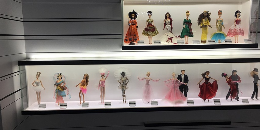 A stunning Barbie doll display featuring elegant designs and intricate fashion details