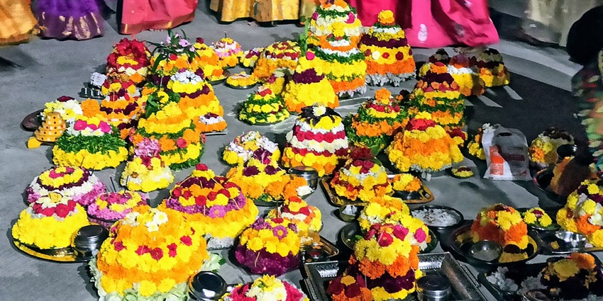 View of colourful traditional baskets of yellow flowers, during the Bathukamma festival.