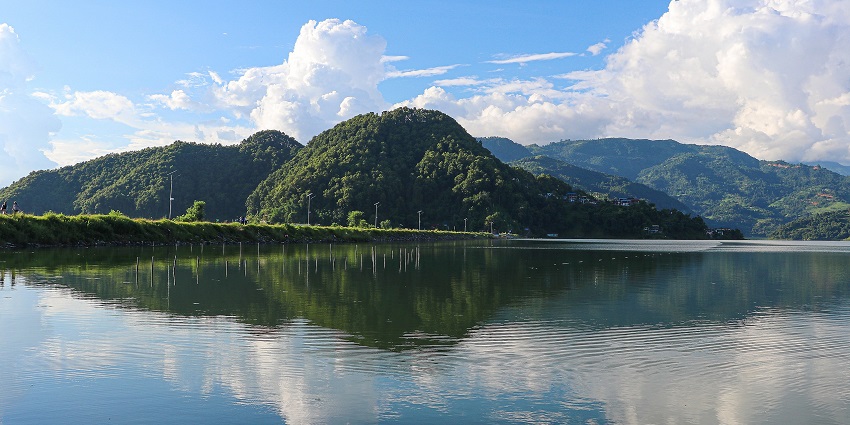 Scenic view of Begnas Lake in Pokhara, surrounded by lush green hills and calm waters