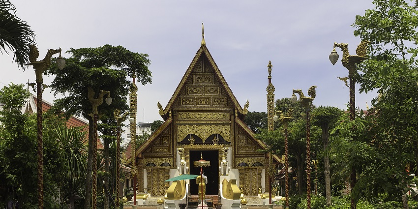 A scenic view of Chiang Rai, Thailand, under clear blue skies, perfect for sightseeing.