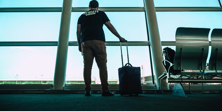 An image of a traveller in an airport terminal at the Jeffreys Bay Airport, South Africa.