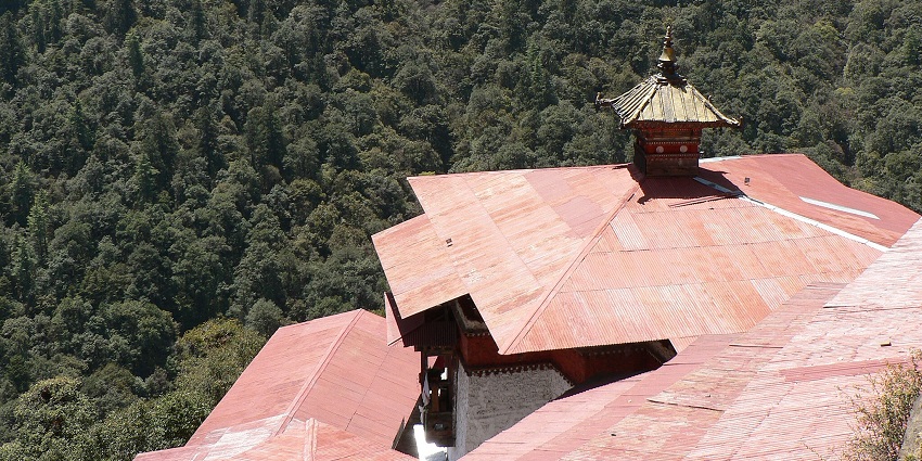 An image showing a stone corridor in a monastery, resembling Cheri Monastery in Thimphu.