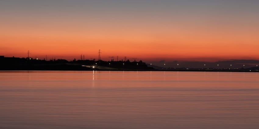 An image of the scenic sunset at Caspian Sea, a serene view from behind Baku Coast
