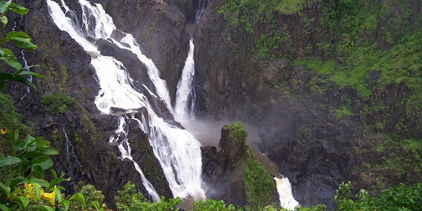 The breathtaking view of Barron Falls during the wet season, with water cascading powerfully.