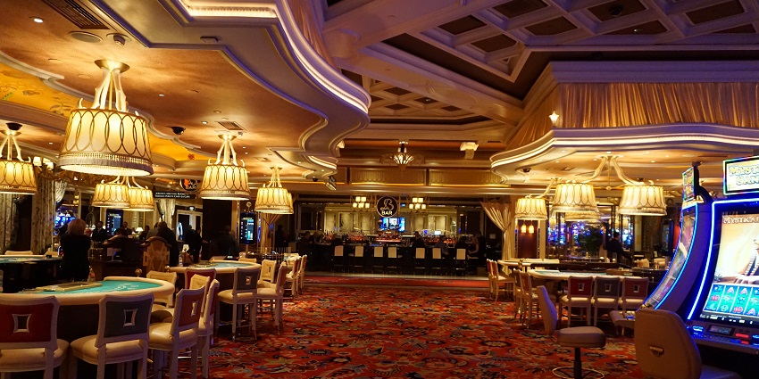 A luxury casino floor with slot machines at Wynn, the biggest casino in Las Vegas
