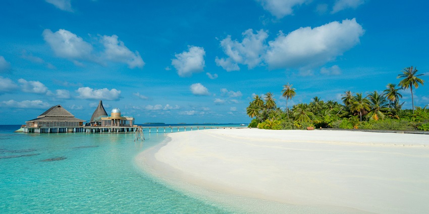 The white sandy beach near the spa at Anantara Kihavah Maldives Villas in Baa Atoll.