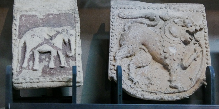 An image of two ancient carved artefacts in the National Museum Colombo, featuring historical significance