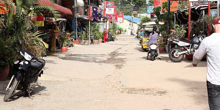 An image showing a street in Sihanoukville, French Street, with buildings and shops.