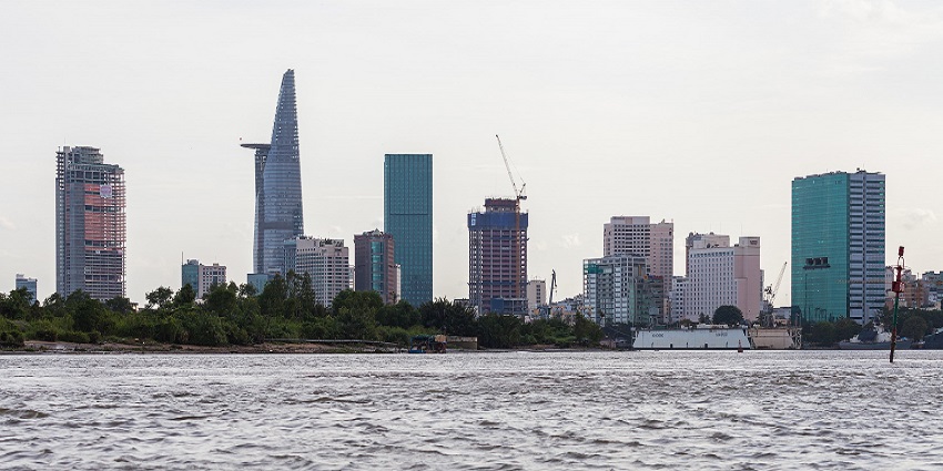 image of the Saigon River in Ho Chi Minh City, Vietnam, with buildings in the background