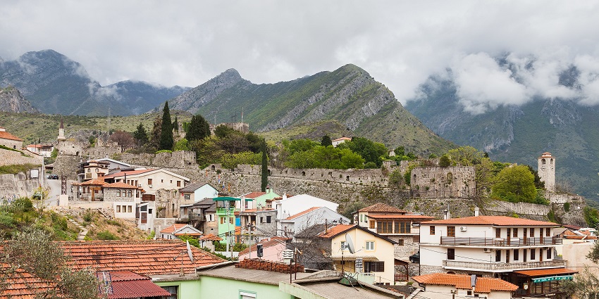 A scenic view of a stunning Montenegro town nestled among majestic mountains.
