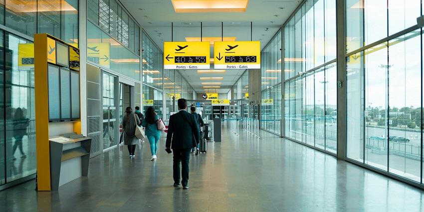 View of travellers walking through the halls of Biggin Hill Airport of London