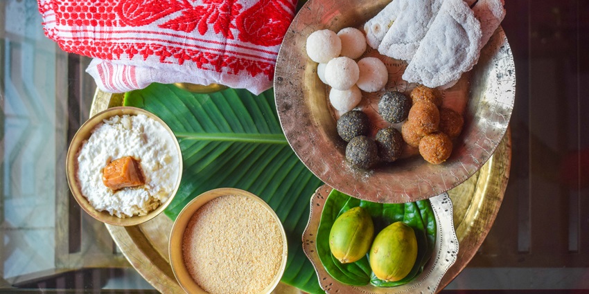 An image of Assamese food thali Bohag Bihu with traditional food